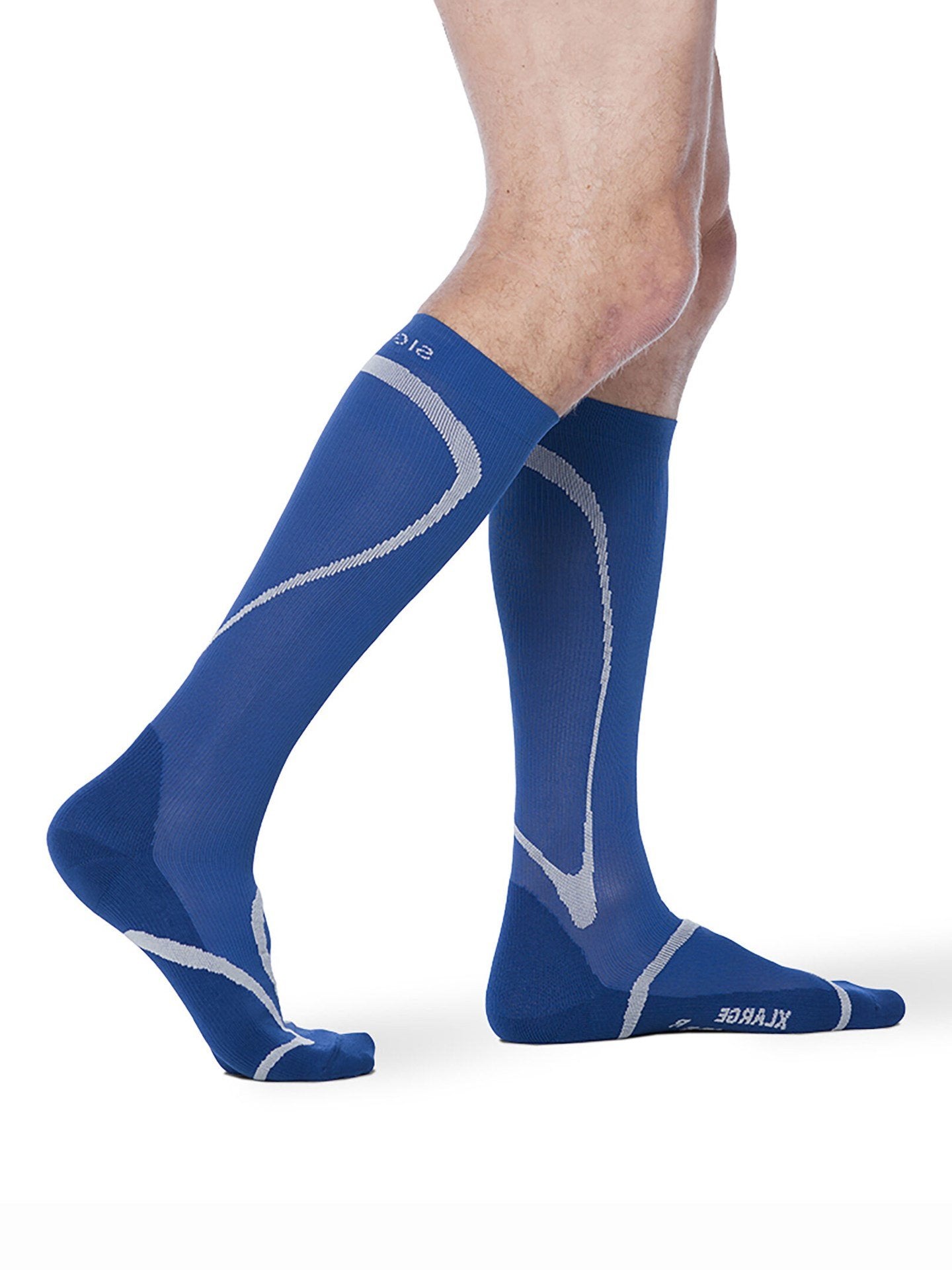 Legs of male model wearing Sigvaris High Tech compression calf socks in blue.