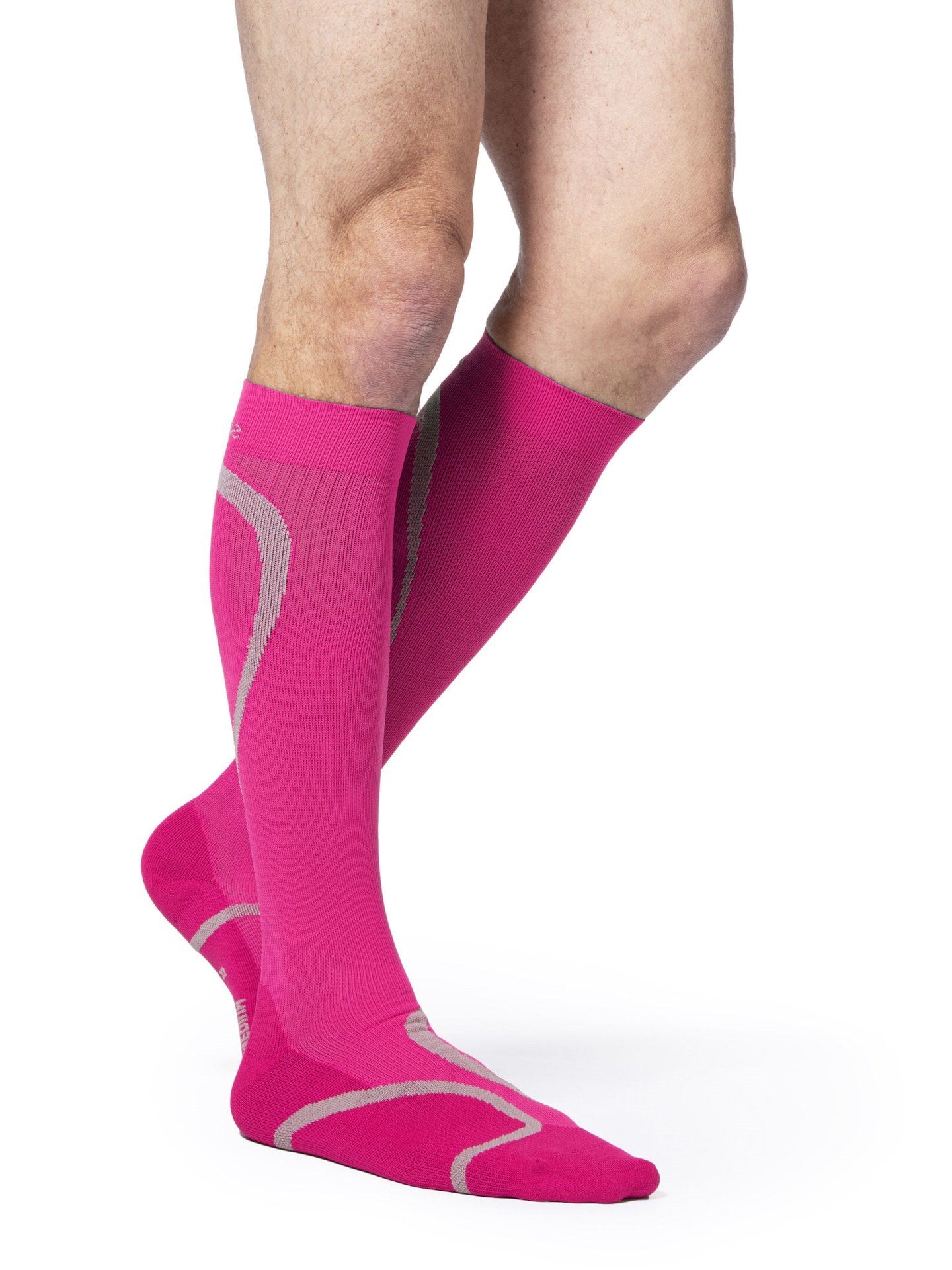 Legs of male model wearing Sigvaris High Tech compression calf socks in pink.