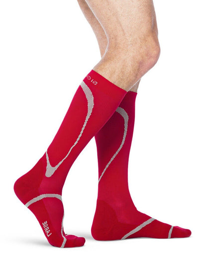 Legs of male model wearing Sigvaris High Tech compression calf socks in red.