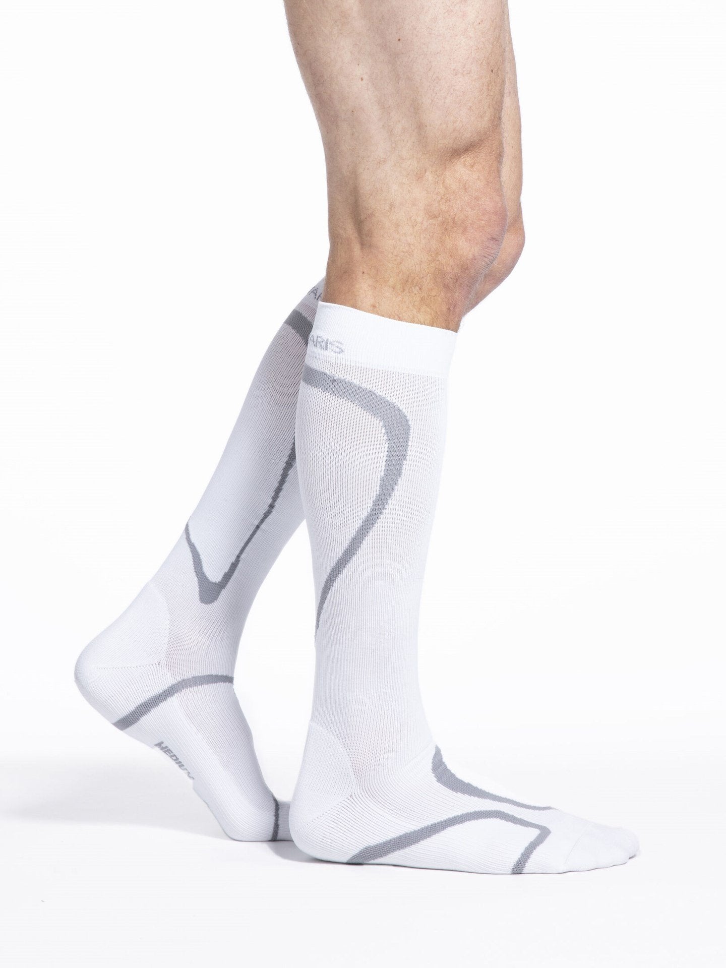 Legs of male model wearing Sigvaris High Tech compression calf socks in white.