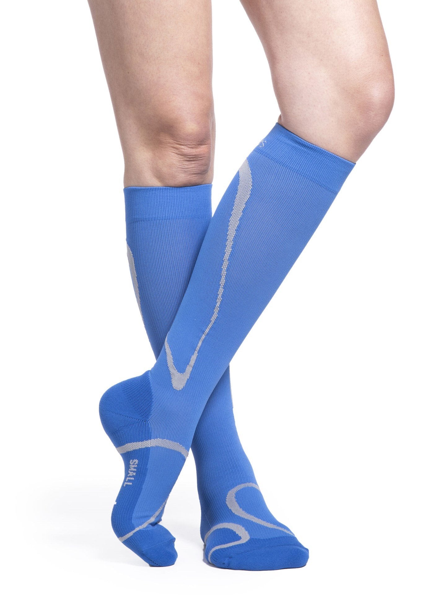 Legs of female model wearing Sigvaris High Tech compression calf socks in steel blue.