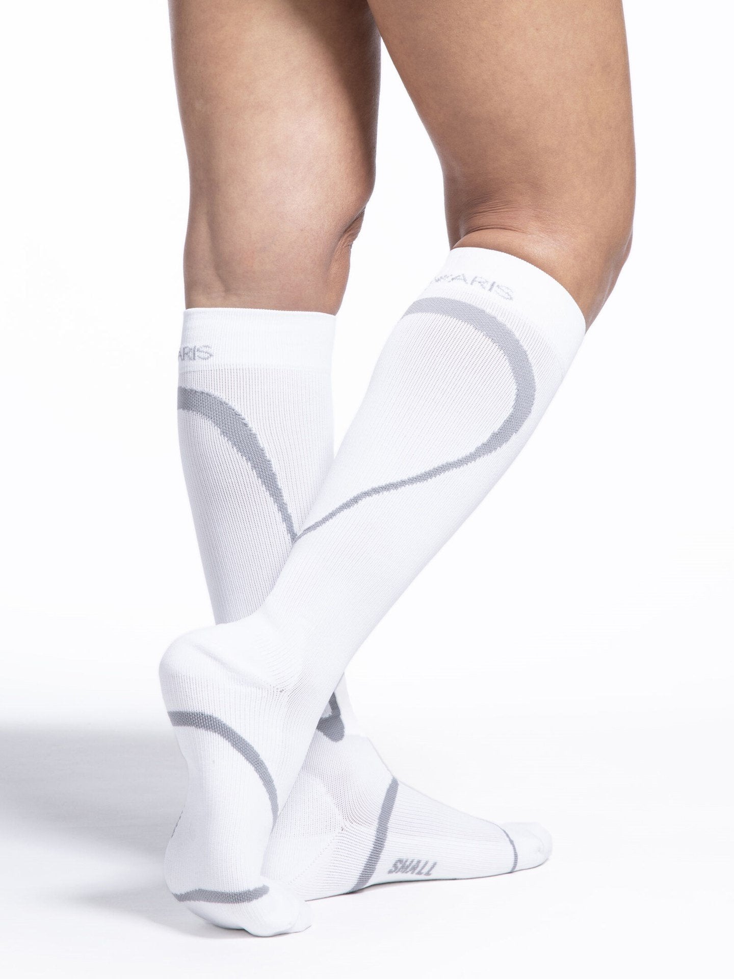 Legs of female model wearing Sigvaris High Tech compression calf socks in white.