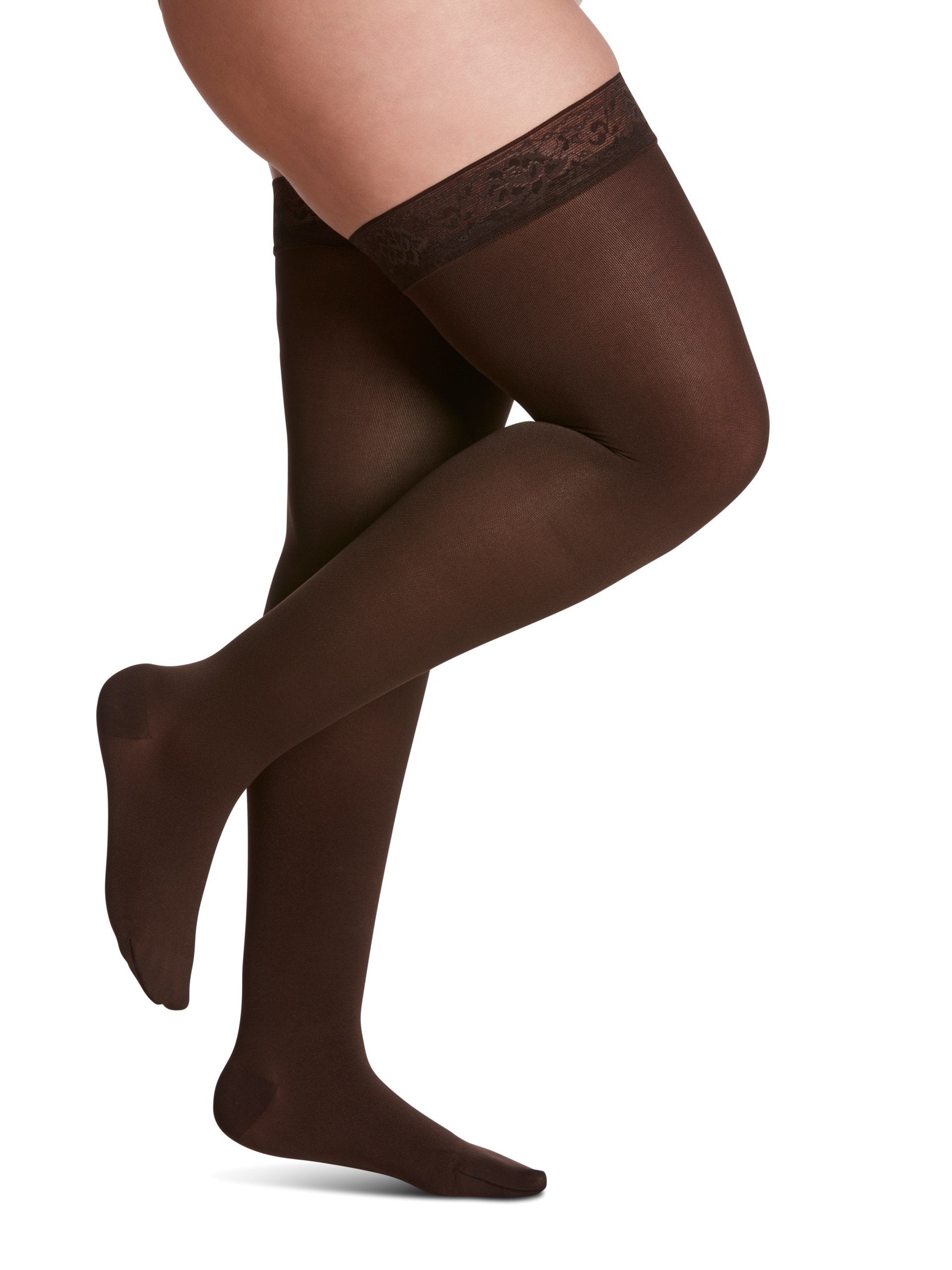 Legs of female model in thigh-high Sigvaris Soft Opaque compression tights in espresso.