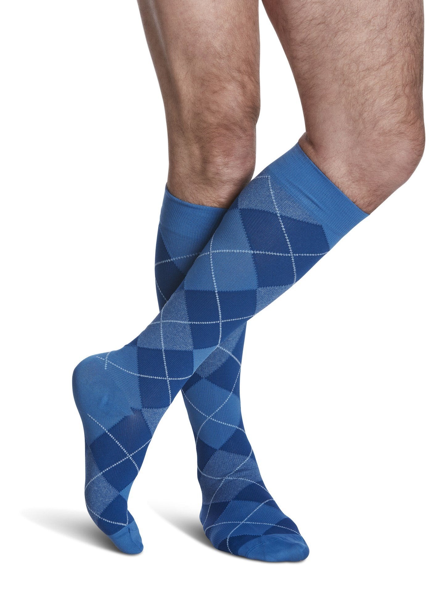 Legs of male model in Sigvaris Microfiber Patterns compression socks in royal blue argyle.