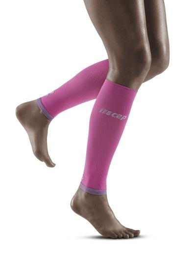 Lower legs of model in CEP Ultralight compression calf sleeves in pink.