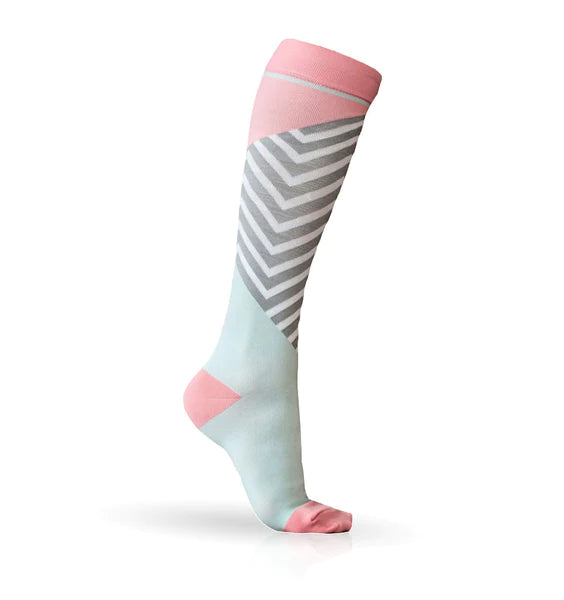 Light pink and pale blue Lunatik Bofa Tech compression socks on white background.